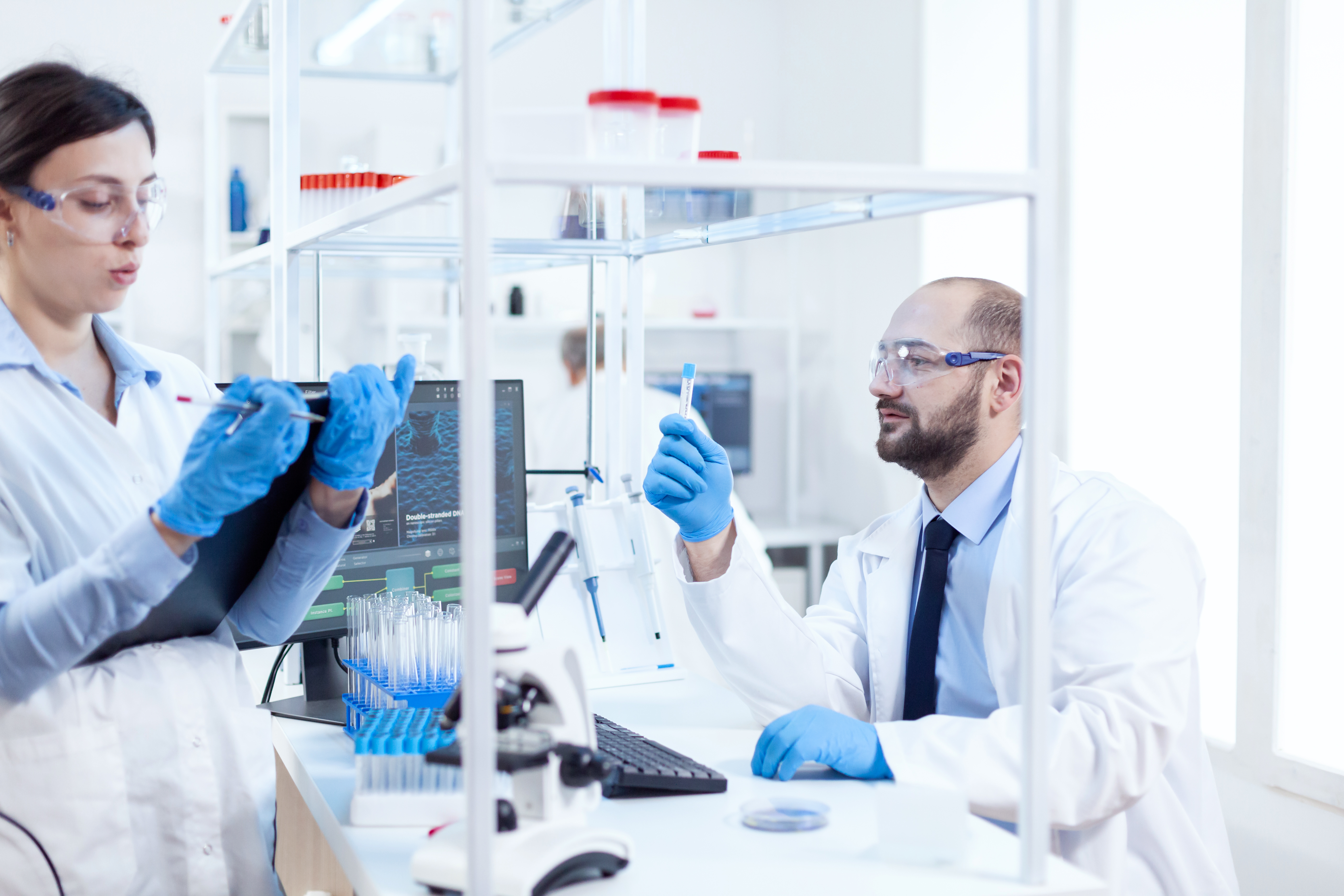 Young man scientist looking pensive at chemical solution
